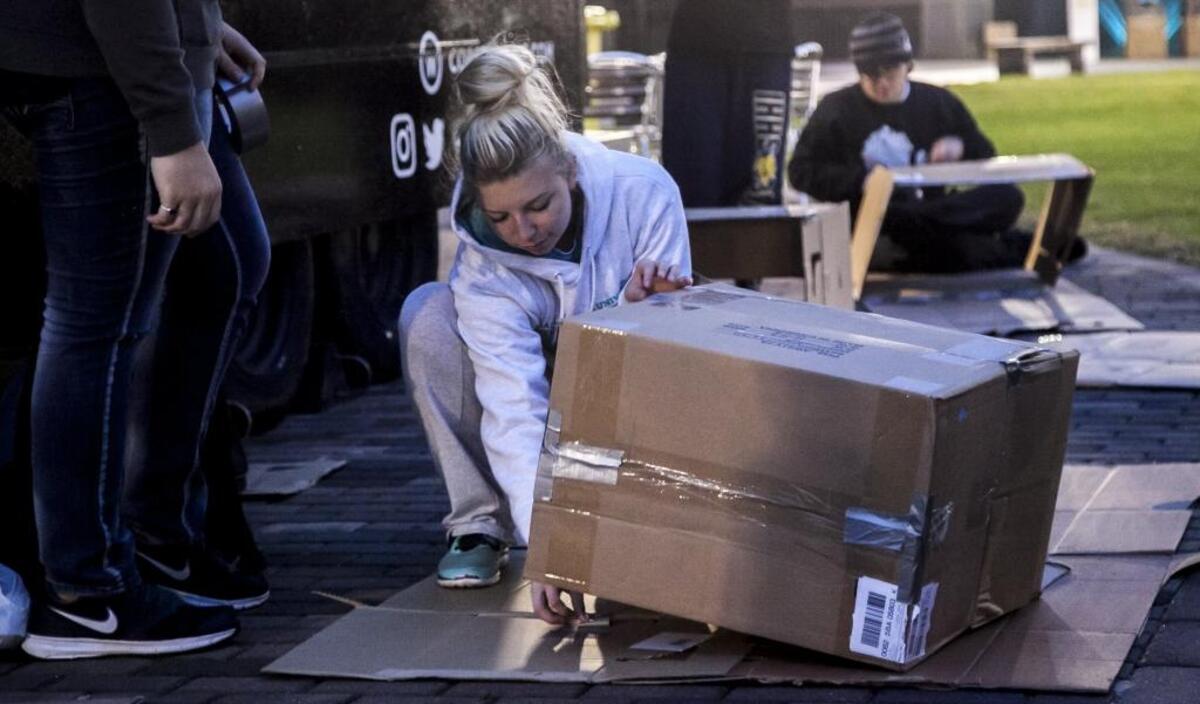 Jazmine Bombagi (left) and Xavier Jackson construct shelters from cardboard boxes. The CCU students plan to camp out overnight on the Prince Lawn in cardboard boxes to raise awareness of the homeless. Thursday, November 9, 2017.
