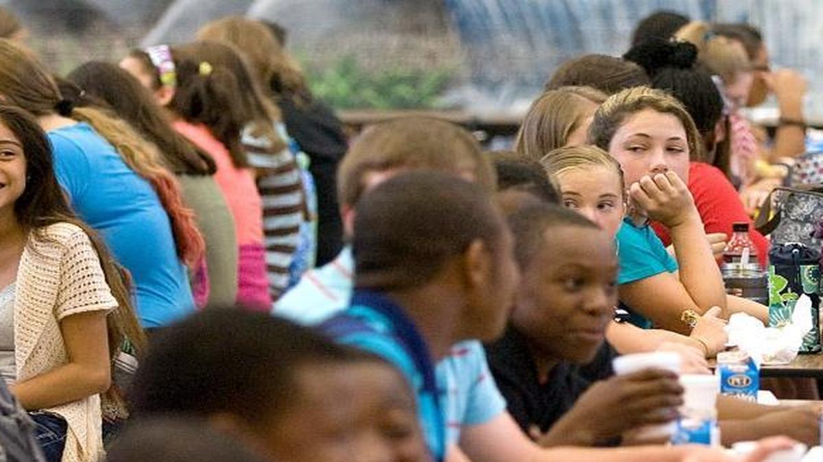 Girls laugh and stare at boys in the lunch room at Whittemore Park Middle School on Wednesday, Aug. 4, 2013. The Horry County Board of Education voted to keep class sizes stable Monday after several months of debate.