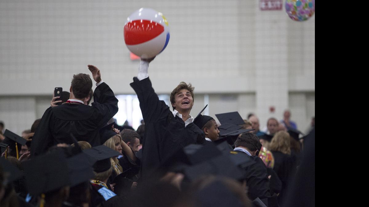 
Justin Knipper (18) hits a beach ball after Socastee High School held its 2015 commencement ceremony Thursday at the Myrtle Beach Convention Center in Myrtle Beach.
