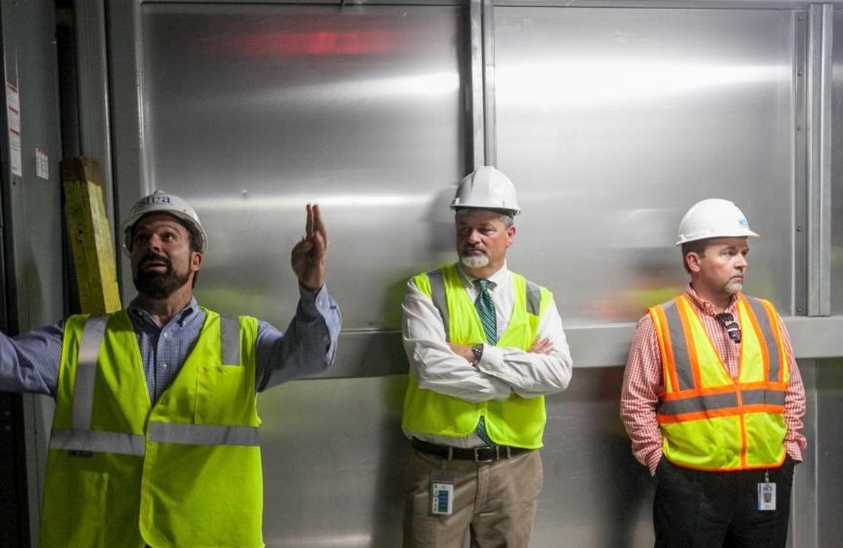 Horry County Schools Executive Director of Facilities Mark Wolfe (right) and Superintendent Rick Maxey (center) stand by as FirstFloor Energy Positive CEO Robbie Ferris (left) gives a tour of Ten Oaks Middle School on Thursday, Sept. 22, 2016.