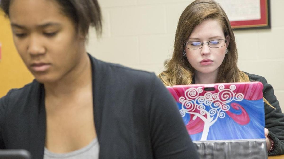 
Kennedy Anderson (front) and Megan Boyd work on an English assignment on their tablet computers. 
