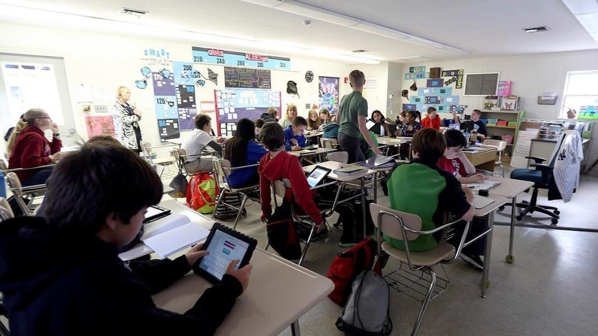 Ocean Bay Middle School students work on their digital devices during an algebra class.