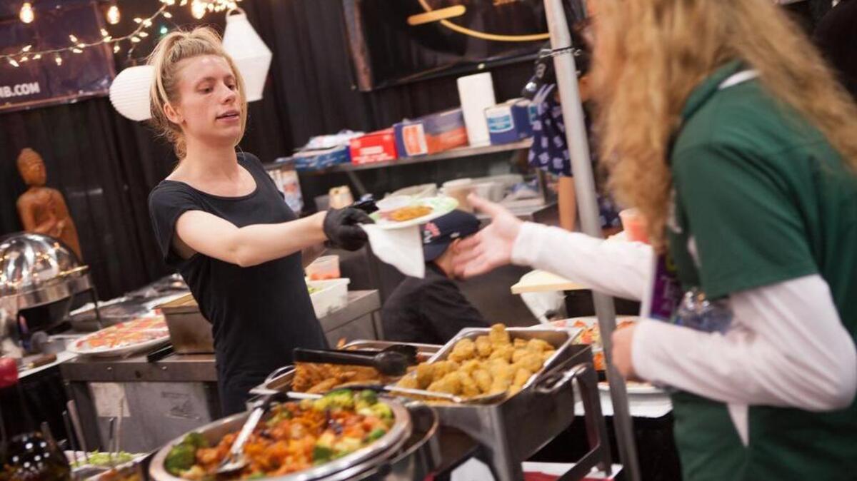 Alex Ruff of Hot Tomato hands an appetizer to a hungry patron at the 33rd annual Taste of the Town on Oct. 18, 2016 at the Myrtle Beach Convention Center.