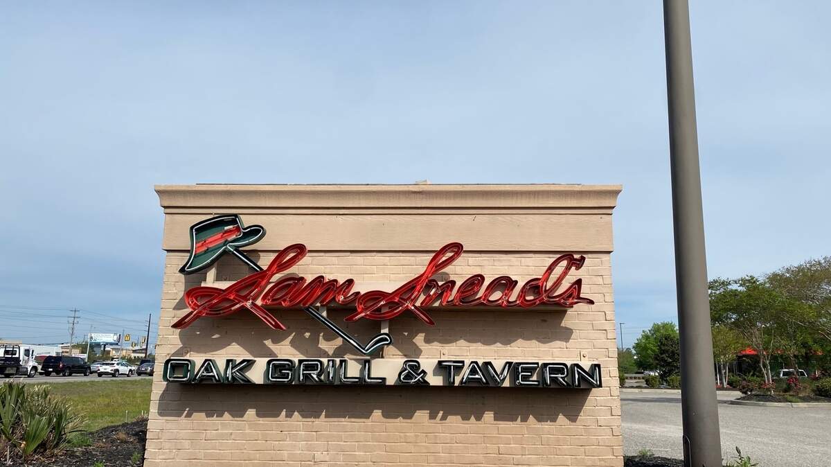 Sign outside Sam Snead’s Oak Grill and Tavern on Glenforest Road. March 28, 2023.