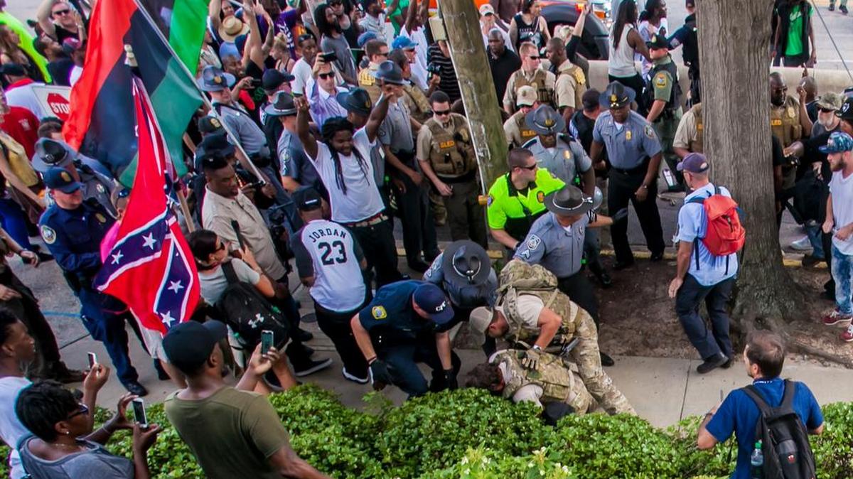 Law enforcement make an arrest following a KKK rally at the State House in Columbia, SC. 7/18/15