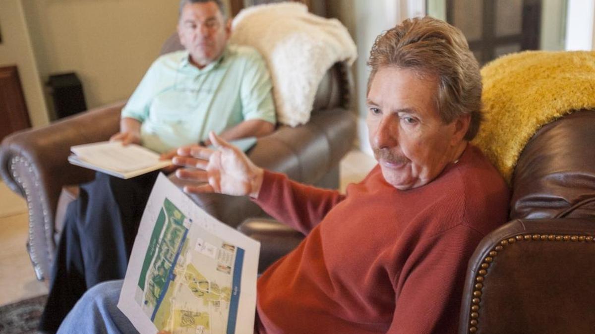 Gerald Ogden (front) and Gary Foster, Grande Dunes residents, are concerned that an adjacent new development with more than 800 homes will increase traffic and devalue their property.
