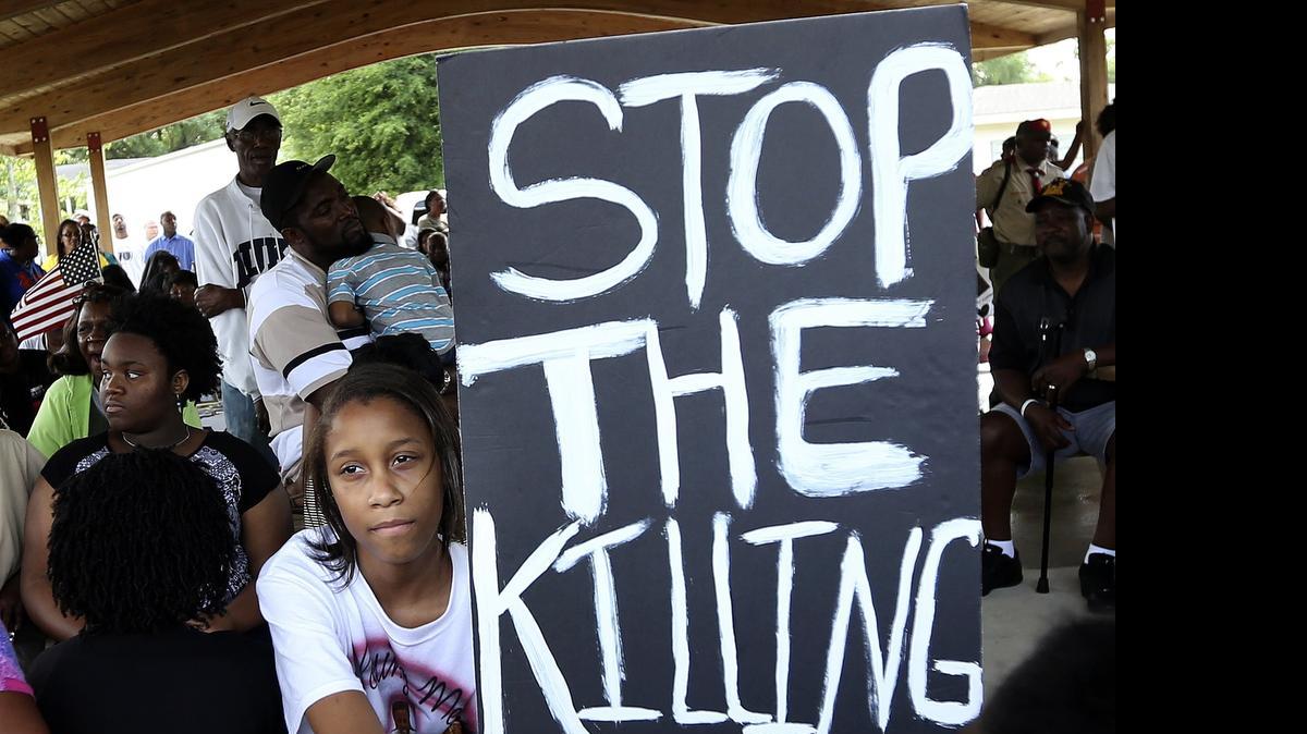 
Hundreds gather for the Community Empowerment 2015 Peace Rally at Popular Park off S.C. 90 in western Horry County on Saturday. The rally centered on finding ways to stop the violence that has left so many of the youth from the Longs community dead. Tropical Storm Ana caused the organizers to cancel the planned march, but the prayers and rally events continued.
