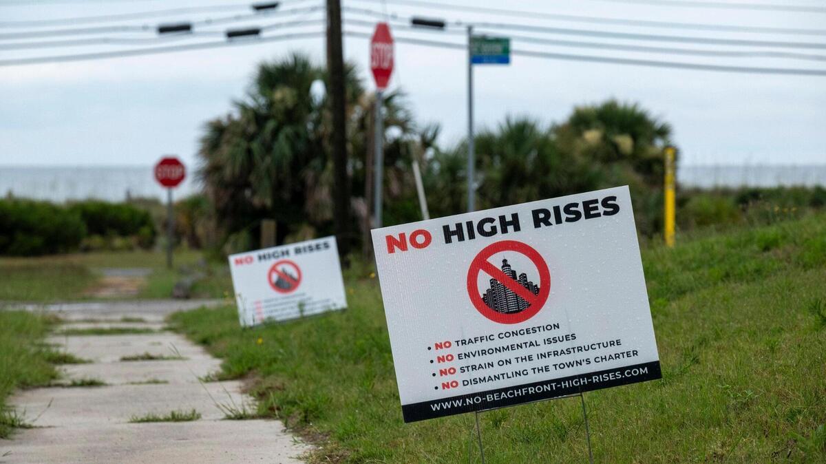 Signs lining the streets protest high rise development in Atlantic Beach, S.C. Atlantic Beach residents have spent months waiting to learn the fate of a proposed $100 million 21-story hotel and cultural center called the “Black Pearl of the Atlantic.” While some residents see future development as a chance for economic recovery, other are concerned about the environmental and lifestyle changes that ocean front development might bring. July 10, 2023.