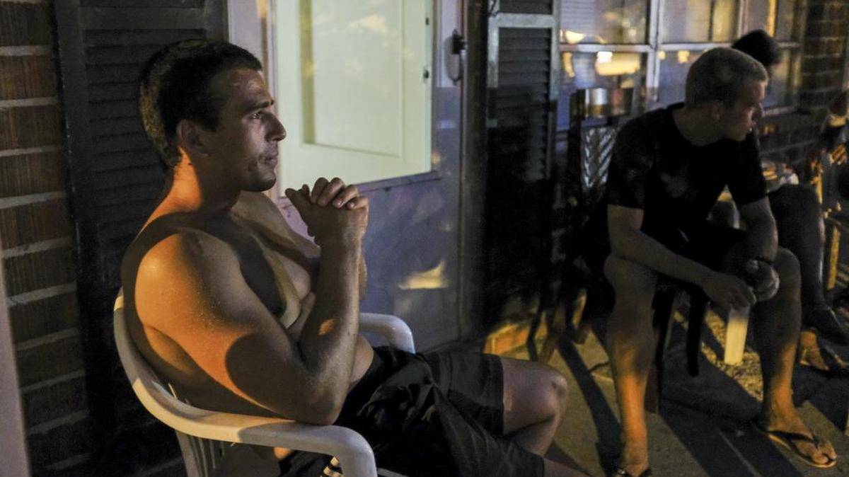 Working as a lifeguard for Lack’s Beach Service, Bobby Katerinksi of Bulgaria rests on his porch with other lifeguards after a long hot day on the beach in this 2017 Sun News file photo.