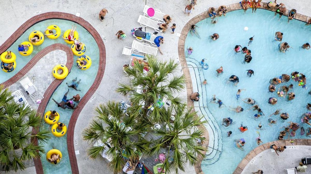 Swimmers fill the pool and lazy river at the Crown Reef Beach Resort and Waterpark in Myrtle Beach on Thursday, July 21, 2016.