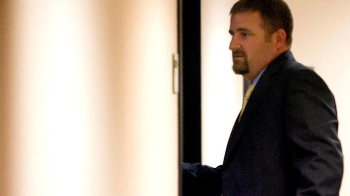 Chris Eldridge walks into the interview room with the Horry County Council in Conway on Tuesday, May 15, 2012.