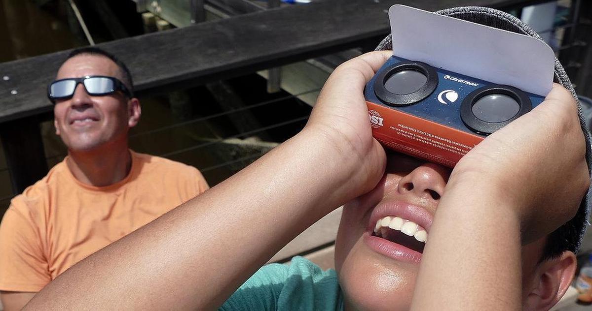 The light changes to gold, street lights come on and near darkness occurs in the solar eclipse on Monday, Aug. 21, 2017, as Georgetown experienced totality.