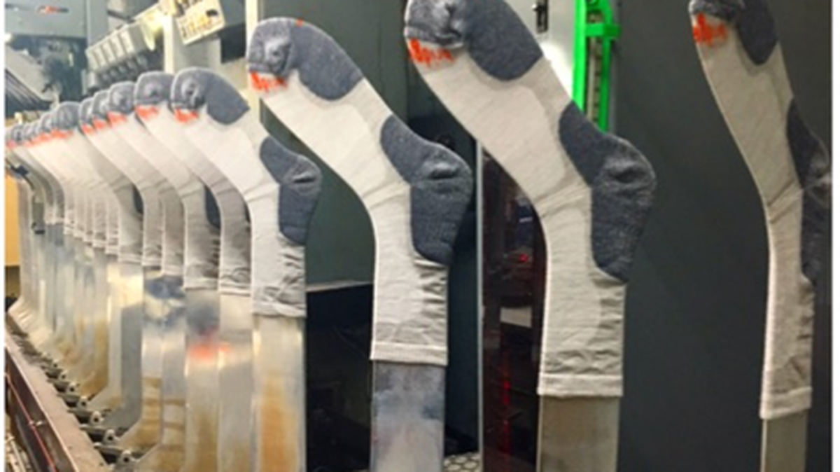 Athletic socks sit on the assembly line of a factory run by UET. Moose Logistics and Distribution, a subsidiary of the company, announced Dec. 13, 2022, it has plans to open a Loris site in the spring.