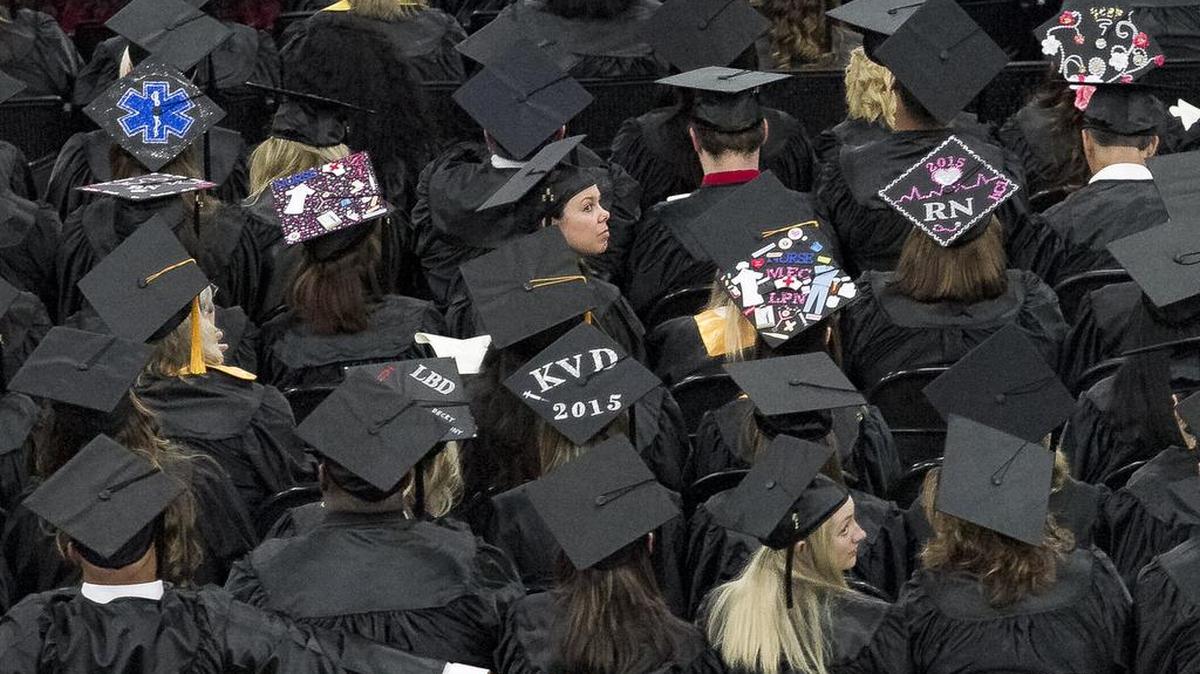 
Some of the graduates decorate their caps with phrases and art at the HGTC commencement ceremonies. 
