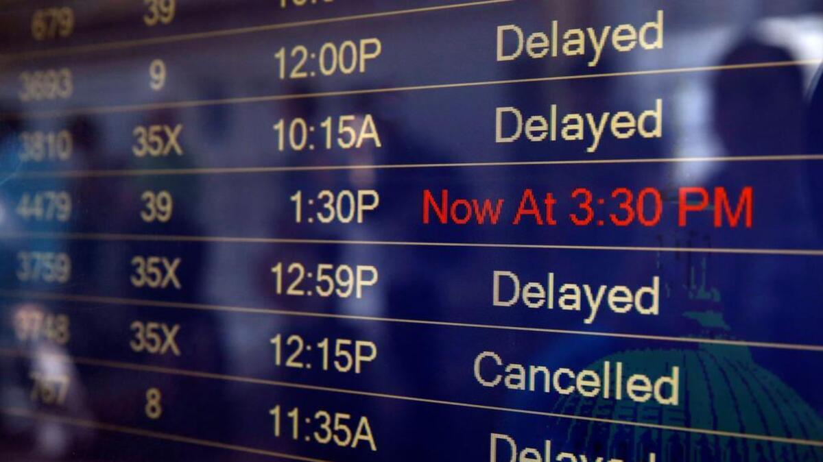
The arrivals and departures board shows the delayed and canceled flights at Washington’s Reagan National Airport after technical issues at a Federal Aviation Administration center in Virginia caused delays on Saturday.
