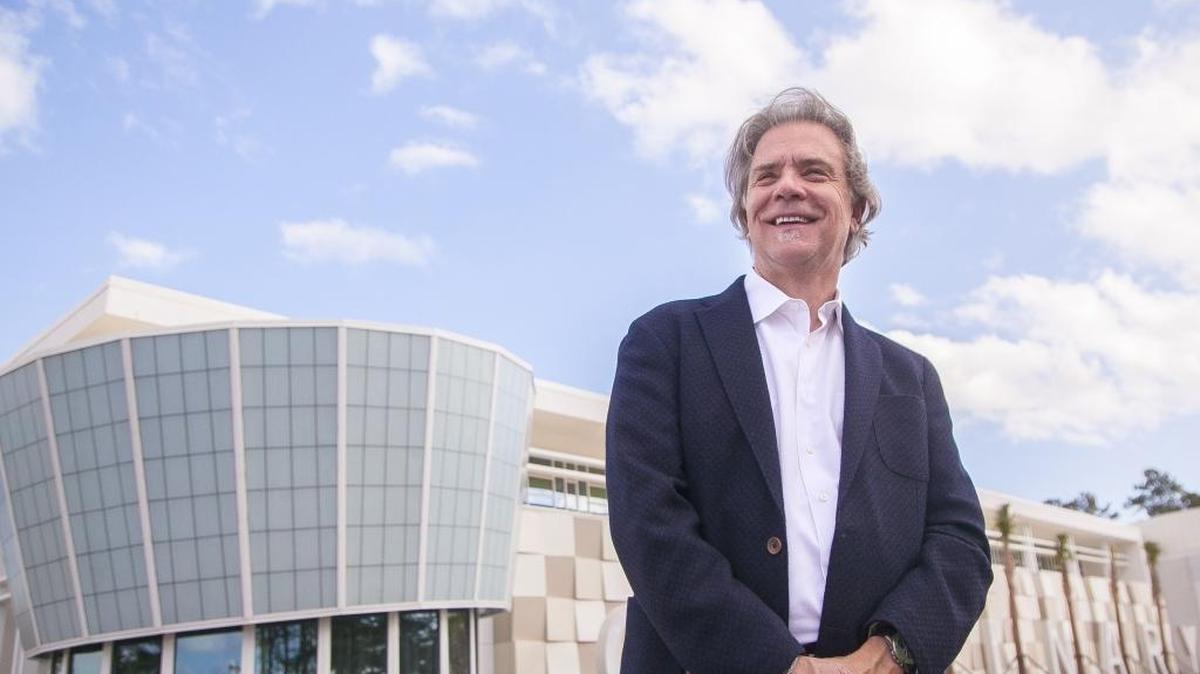 Derrick Mozingo Jr. of Mozingo + Wallace Architects stands in front of one of his most recent designs, the HGTC Culinary Institute.