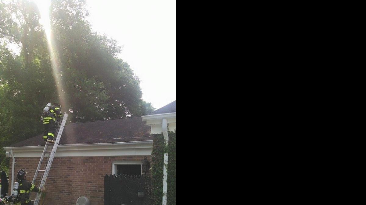 
Firefighters work to extinguish blaze Wednesday morning. 

