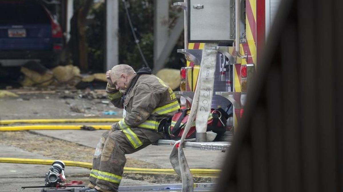 After battling the early morning fire, a Murrells Inlet-Garden City Fire Department firefighter takes a break outside the scene of a fatal house fire in 2014 in Garden City Beach. The family of a Timmonsville couple who died in a Garden City Beach house fire in 2014 blames a defective golf cart for causing the disaster and is suing the cart’s manufacturer and one of its parts suppliers, according to court records.