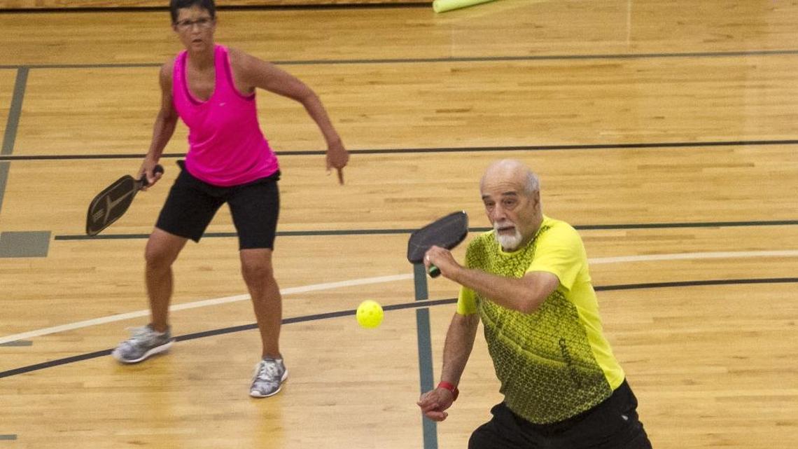 FILE: Rich Kuhn and Peggy Wells played pickleball on the multi-use courts at Carolina Forest Recreation Center in Myrtle Beach in 2017.