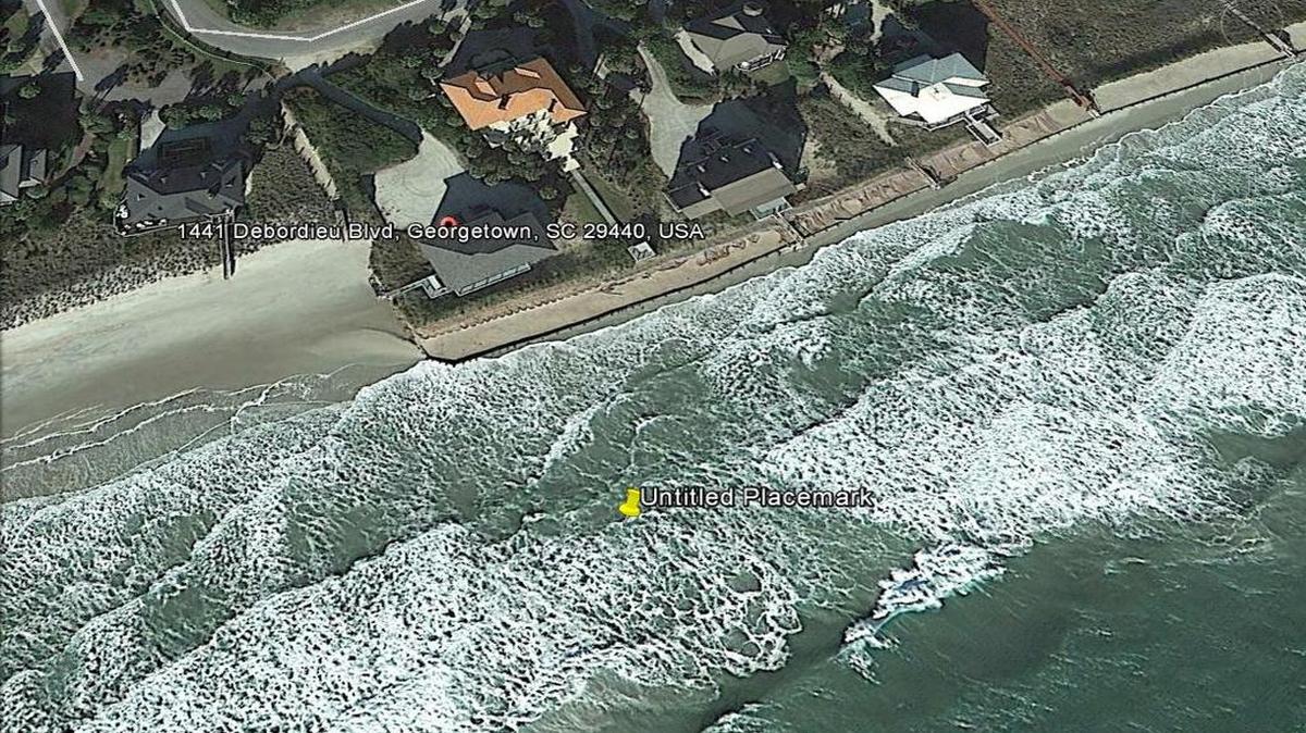 
A seawall juts onto the beach at Debordieu, an exclusive resort south of Myrtle Beach. The Legislature approved replacing the wall last year, despite a quarter-century ban on new seawalls in South Carolina. Seawalls worsen beach erosion when hit by waves. Since this photo was taken, property owners at Debordieu have widened the beach through a renourishment project. But the sand is expected to eventually wash away, exposing the wall. The wall protects about two dozen oceanfront homes.
