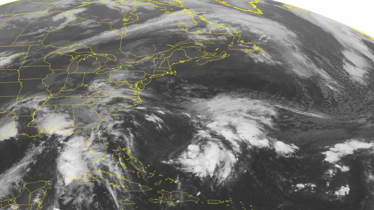 
This NOAA satellite image taken Monday, Sept. 28, 2015, at 12:45 AM EDT shows newly formed Tropical Depression 11 well to the east of Florida and to the north of Hispaniola. Tropical Depression 11 has sustained winds of 35 mph and will move to the north away from the United States. An area of low pressure in the Gulf is producing rounds of rain and thunderstorms over the Gulf Coast. This system will stay relatively stationary over the next couple of days. Light rain showers can be expected across the Mid-Atlantic. High pressure will start to lose its grasp over the Northeast on Monday where a few showers are possible. Temperatures will be above average in the Northeast due to this high pressure. (NOAA/Weather Underground via AP) 

