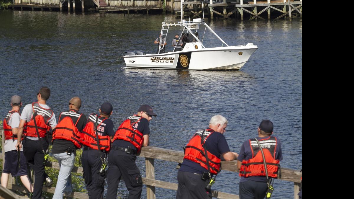 
Rescue crews search for a missing swimmer in the Intercoastal Waterway in front of the Clarion Hotel on Friday afternoon.
