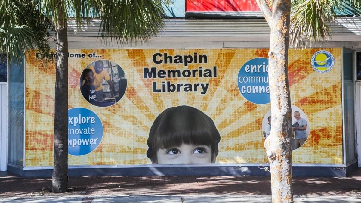 A sign announcing the new home of the Chapin Memorial Library is on one of the store fronts of the “superblock” in Myrtle Beach.
