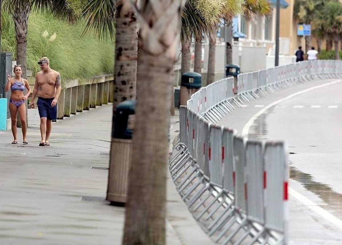 The barricades restrict movement from the sidewalks to Ocean Boulevard near Family Kingdom on Monday.