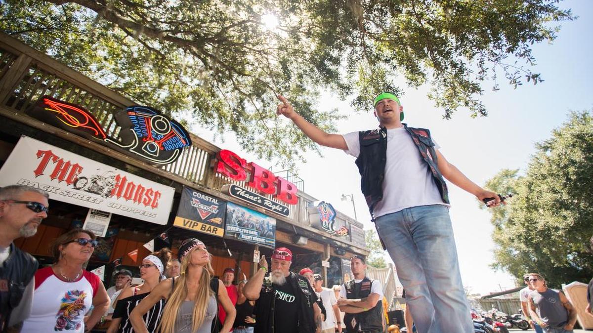Chris Price lays out the days plan as the Reapers Motorcycle Club holds a fundraiser event for Huntington Beach State Park Nature Center on Sunday in an effort to help rebuild the center that was destroyed by fire in July.