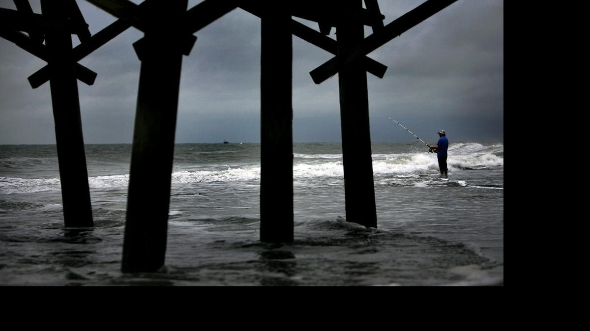 
Tom Dexter of Myrtle Beach tries his luck fishing in the Atlantic Ocean near the Second Avenue Pier.
