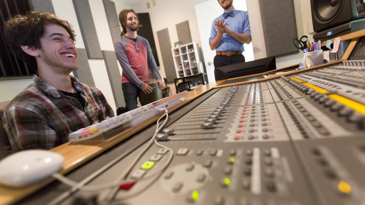 Dr. Matthew White, a music professor at Coastal Carolina University, collaborates with student studio technicians Christopher Schew and McKinley Devilbiss over a mixing board in the studio at Wheelwright Auditorium. The studio is connected to the auditorium so performances and talks can be recorded with smaller rooms inside the actual studio for ensembles or singular artists.
