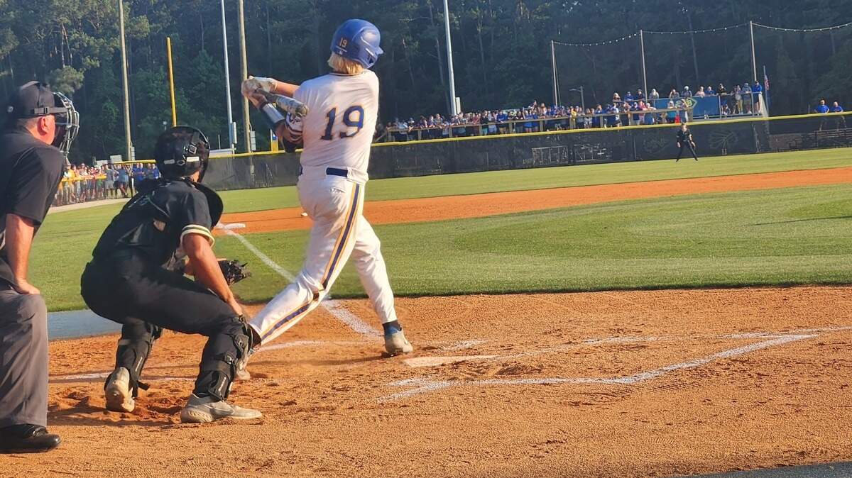 North Myrtle Beach High School’s Luke Roupe swings through a pitch in the top of the first inning of a May 24, 2023 state title game against Catawba Ridge.