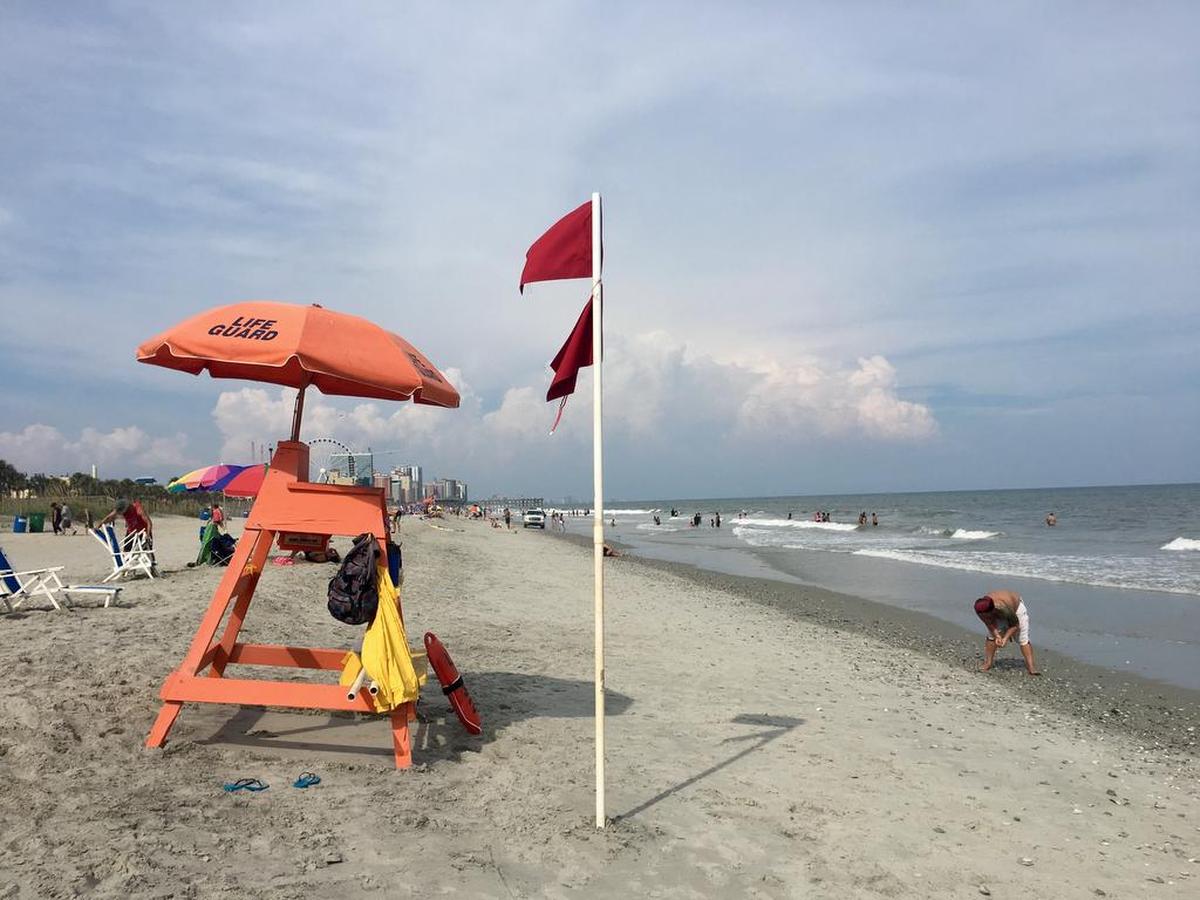 Double red flags warning of a no-swim advisory were flying from lifeguard stands along Myrtle Beach Sunday, Aug. 20, 2017.