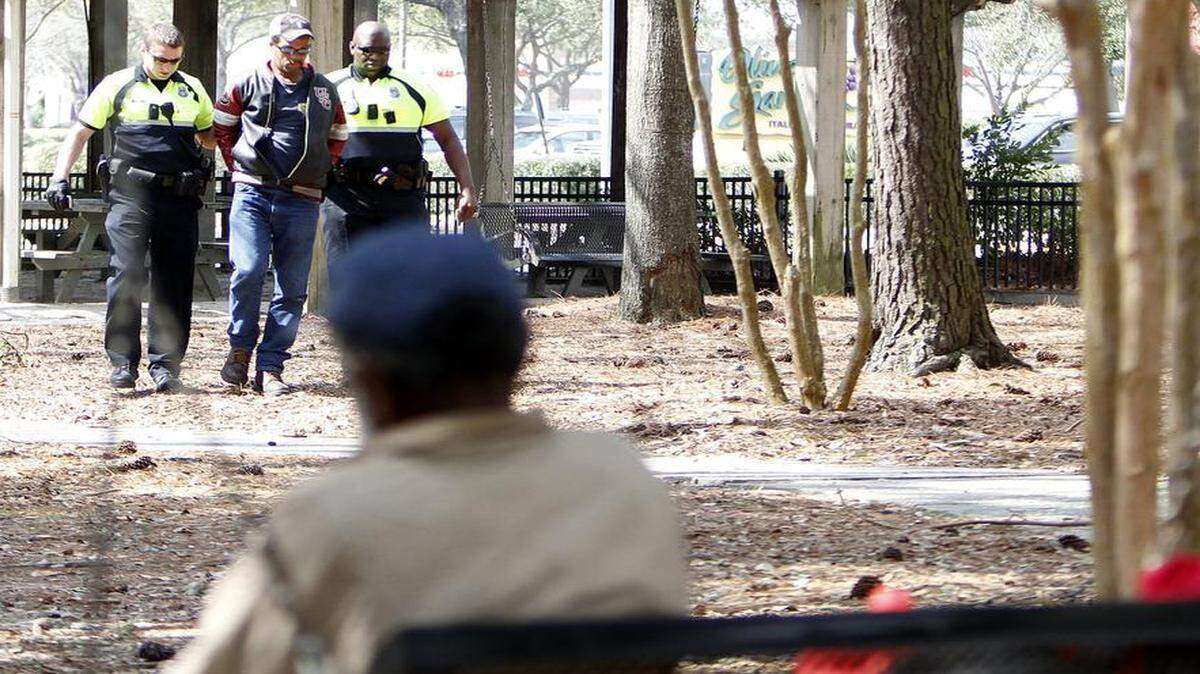 
The man sat at the park bench in Chapin Park in Myrtle Beach on March 12, 2015. He stood, wobbled over to another bench and finally slide into a picnic table. He was talking loudly to no one in particular. A few homeless men said they knew the man and he has been known to drink mouthwash until he passed out. Within minutes of him sitting at the picnic table, two Myrtle Beach Police officers stood him up and walked him to a waiting patrol car. Photo by Janet Blackmon Morgan / jblackmon@thesunnews.com / @TSN_JBM

