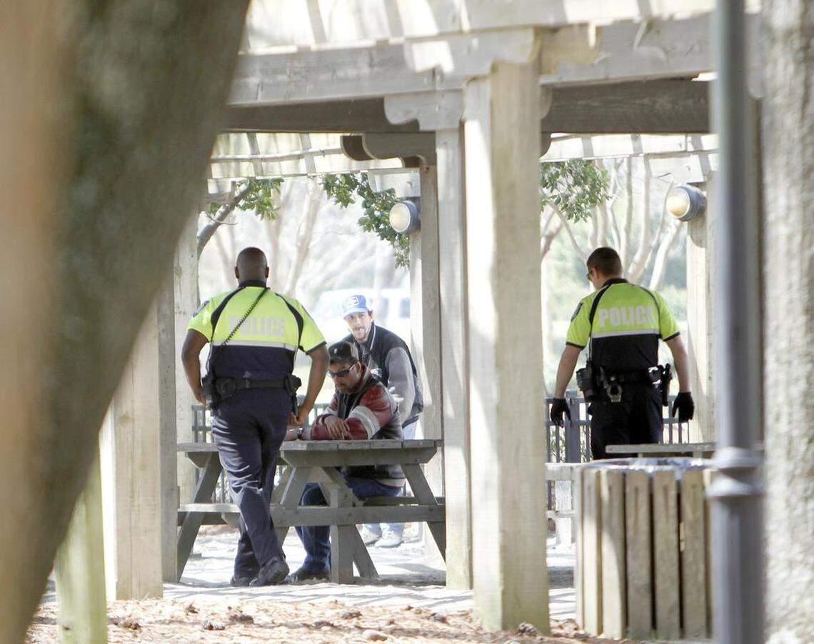 The man sat at the park bench in Chapin Park in Myrtle Beach on March 12, 2015. He stood, wobbled over to another bench and finally slide into a picnic table. He was talking loudly to no one in particular. A few homeless men said they knew the man and he has been known to drink mouthwash until he passed out. Within minutes of him sitting at the picnic table, two Myrtle Beach Police officers stood him up and walked him to a waiting patrol car. Photo by Janet Blackmon Morgan / jblackmon@thesunnews.com / @TSN_JBM