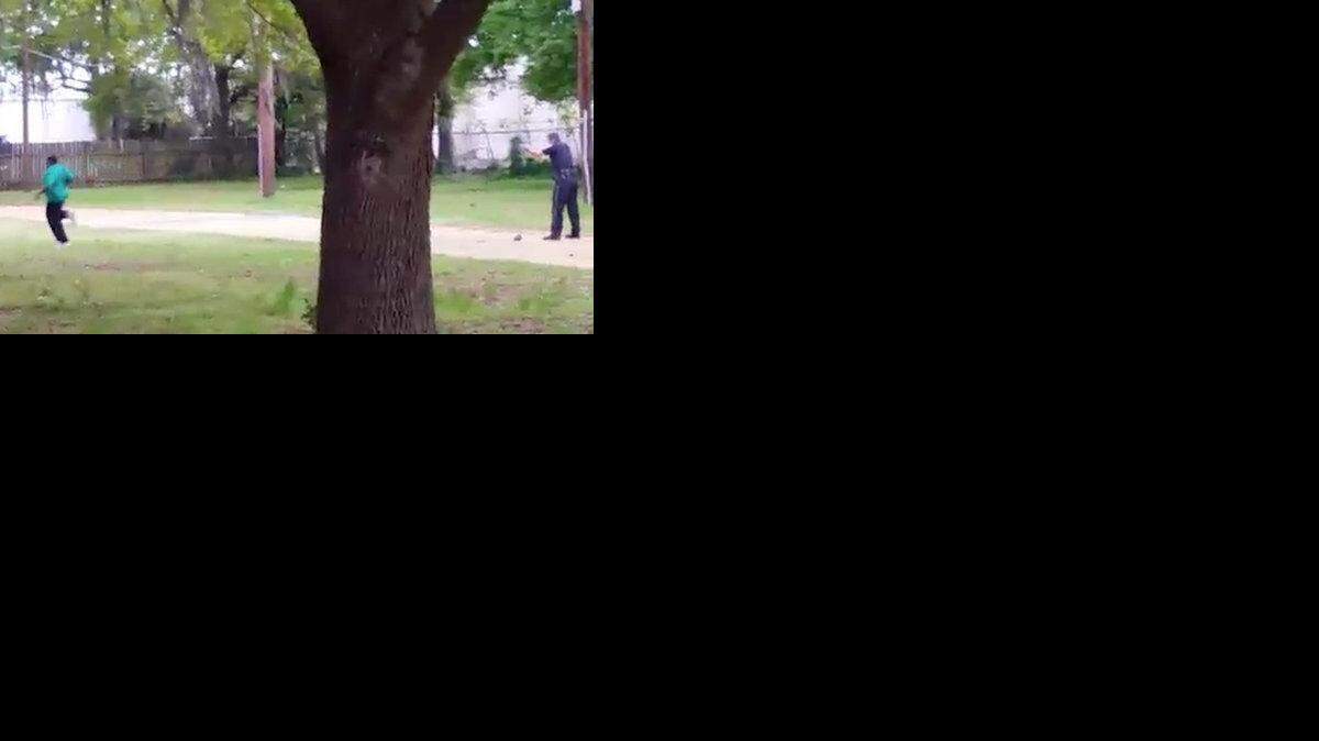
An image from the video of a North Charleston police officer shooting a man multiple times in the back.
