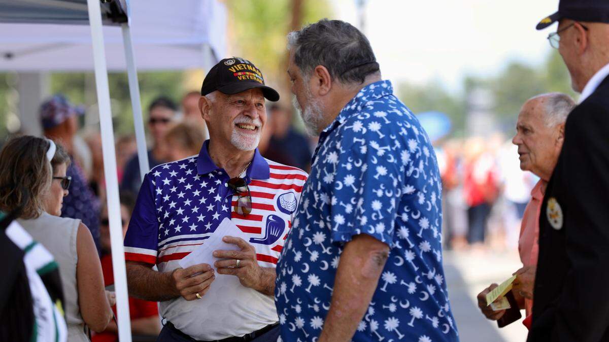 People mingle outside the John T. Rhodes Sports Center in Myrtle Beach on June 20, 2023 ahead of a town hall-style discussion between U.S. Sen. Tim Scott, R-S.C., and Fox News’ Sean Hannity.