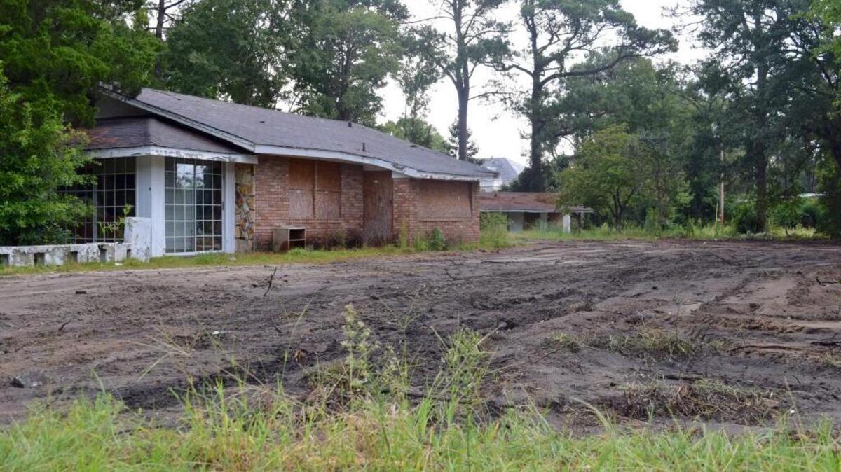 The south side of the Fitzgerald Motel on Sept. 12, 2016. The strip of rooms that used to stand there are now a path of mud, but the central building and the north side of rooms are still standing.