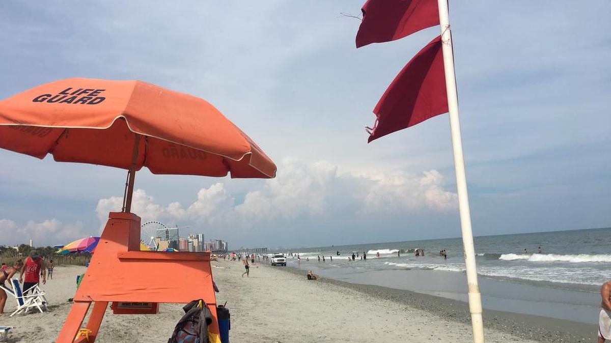 Double red flags warning of a no-swim advisory were flying from lifeguard stands along Myrtle Beach Sunday, Aug. 20, 2017.