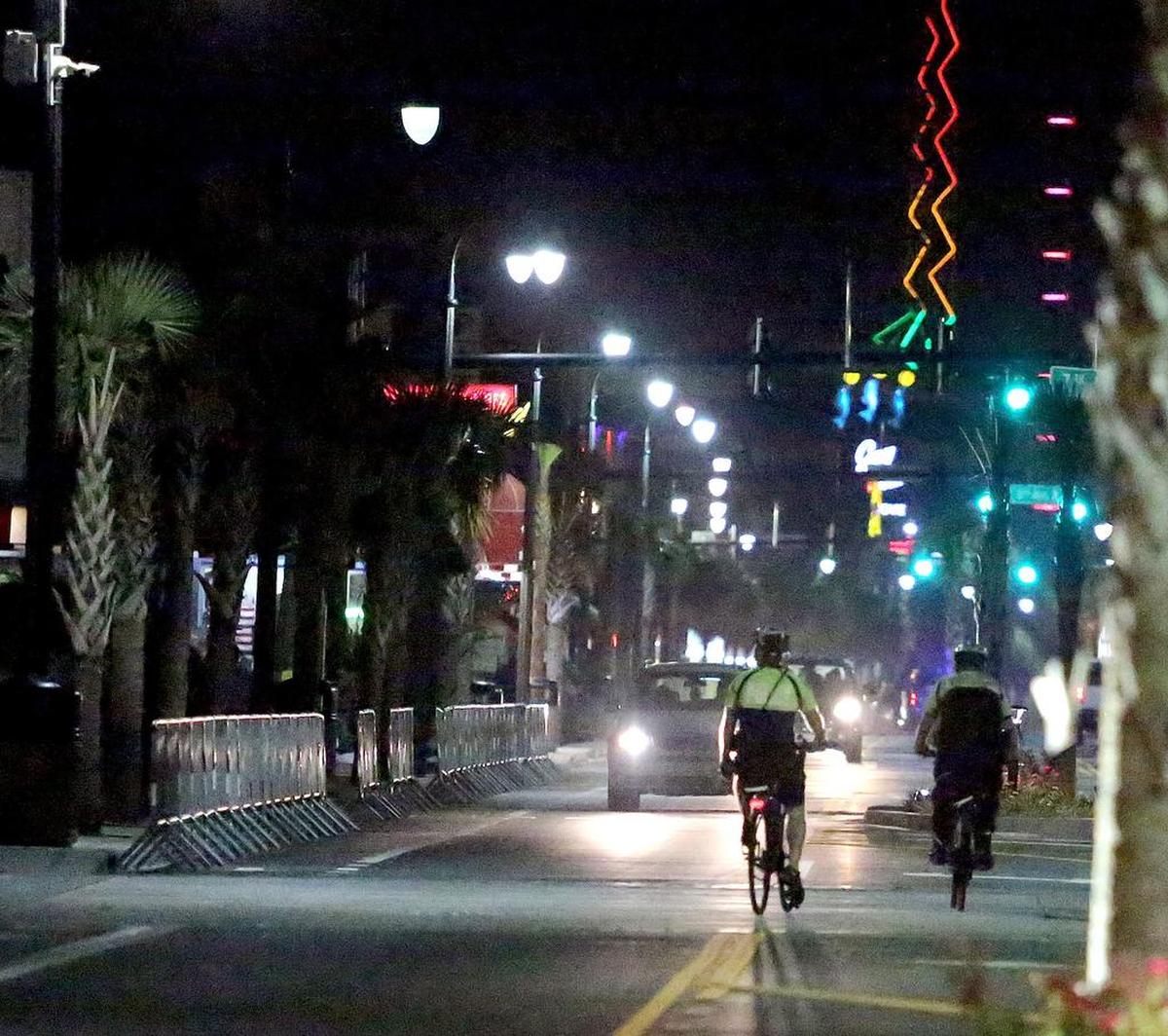 A week after the shootings, Myrtle Beach’s Ocean Boulevard is covered by police officers after midnight on Saturday, June 24, 2017.