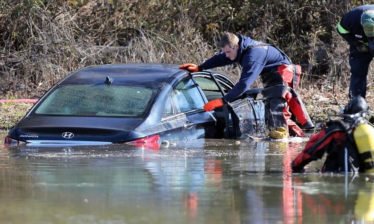 Horry County Fire Rescue divers search a pond on Hulls Island Road in the Longs community Saturday morning. By 12:30 p.m., two bodies and a vehicle were removed from the irrigation pond. Capt. Mark Nugget, spokesperson for Horry County Fire Rescue, said crews were called to the scene around 2:30 a.m. after a report of a car in the pond. The search resumed around 11 a.m. Saturday. A man who lives near the pond said he heard a noise and looked to see a car sinking in the pond. He said he did not see any one coming out of the pond. The man, who asked not to be identified, said the pond is spring-fed and used to irrigate nearby fields. The pond's depth graduates from around 10 to 12 feet at the end where the bodies and vehicle were found and as deep as 18 feet.