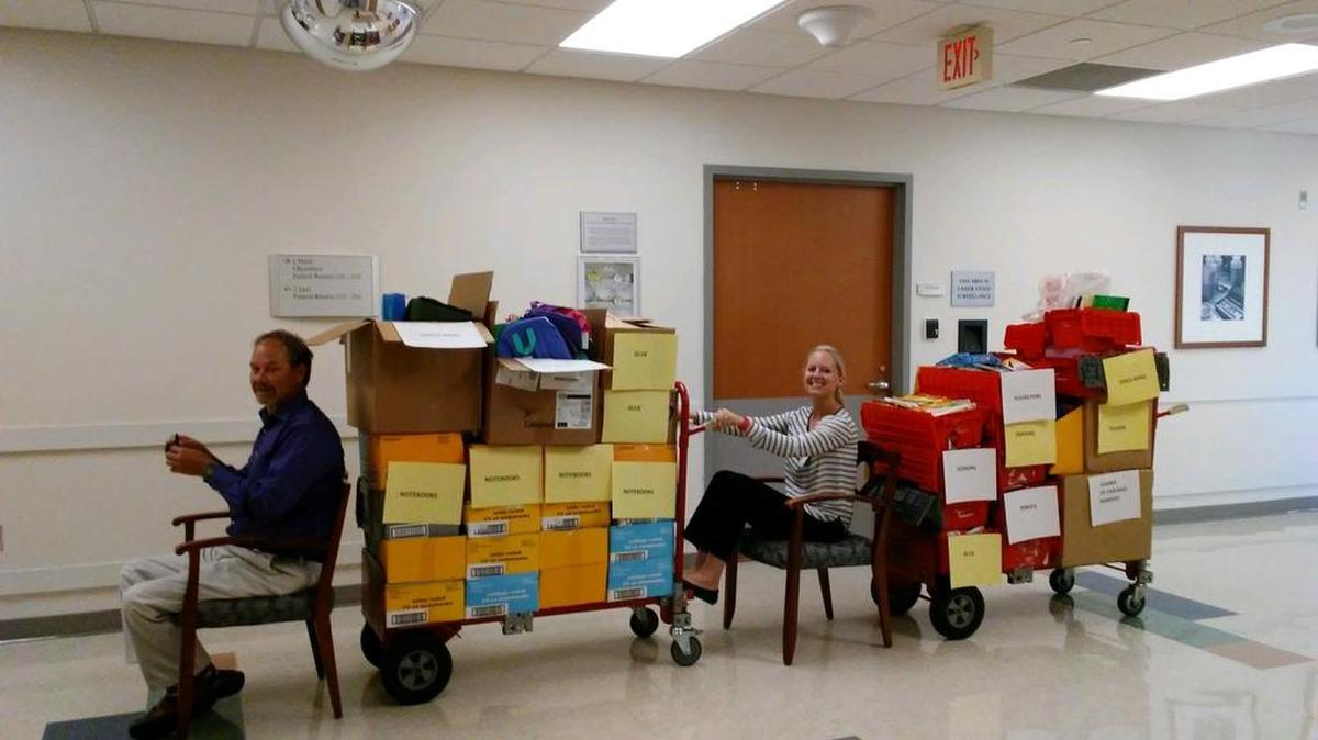 Tidelands Health holds a “Stuff the Bus” campaign each year to collect school supplies for underprivileged children. This year, with strong support from the health system’s employee partners, Tidelands Health delivered two pickup trucks’ worth of supplies to help students in four local schools. The pharmacy at Tidelands Waccamaw Community Hospital was one of the biggest donors to this year's campaign. In this photo, Darrell Willm, pharmacy director, and Kelly Edwards, assistant director, have some fun "driving" supplies collected by the department. Employee partners in at least 10 different Tidelands Health departments donated toward this year's "Stuff the Bus" campaign.