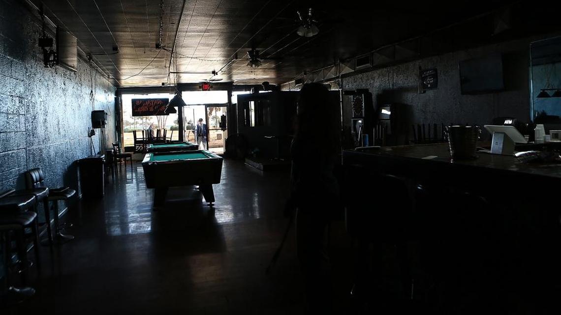 Natalie Litsey goes to her business after Myrtle Beach Mayor John Rhodes announces the city plans to buy most of the superblock and build a library and a branch of the Children's Museum of South Carolina on Tuesday, Jan. 24, 2017. The building Litsey was a tenant in recently sold to the city.