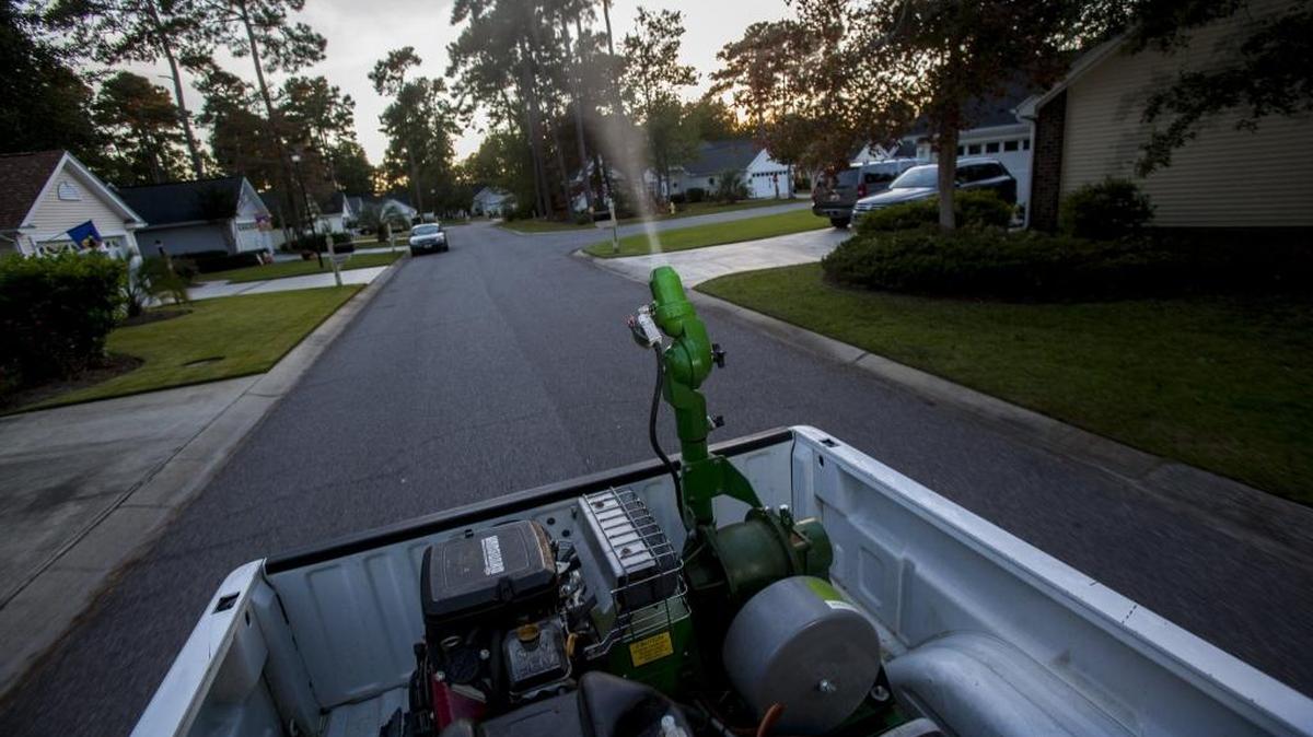 Mac Hardwick drives a truck for Horry County's Stormwater Mosquito Program in the Indigo Creek community of Murrells Inlet.