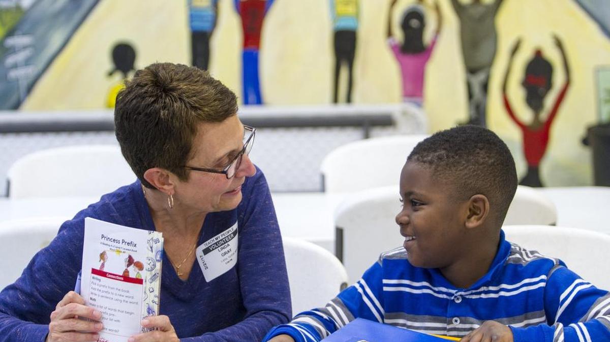 Volunteer teacher Linda Gray works with a student at Teach My People, a faith-based nonprofit, after school program with over 100 students. The organization works to get children up to grade level, starting in first grade and working all the way through high school in Pawley’s Island Feb. 21, 2017.