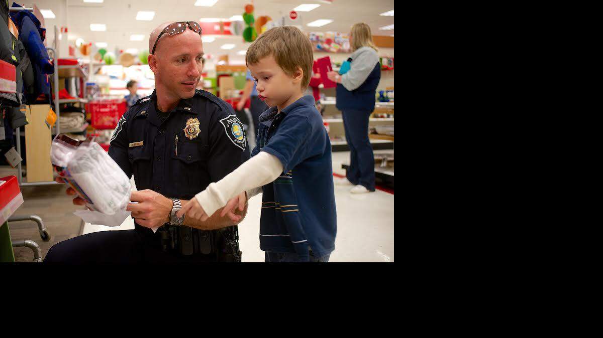 
John Bertang and Will millington start with clothing as they spend Millington's $200 on clothing, shoes, and toys at Target Saturday.
