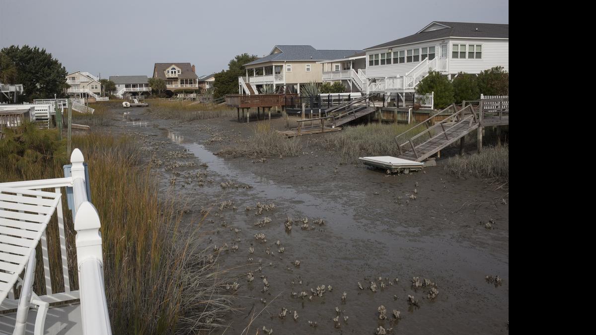 
Photo shows the view from the deck of a North Myrtle Beach during low tide on a Cherry Grove finger canal.
