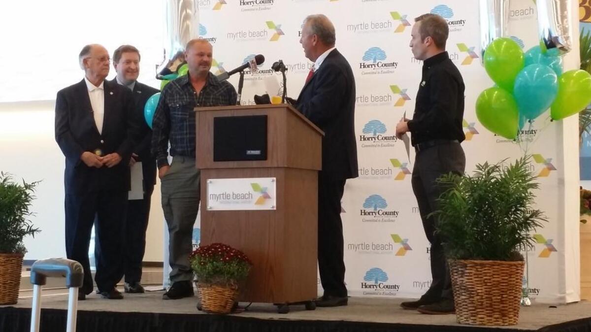 Spirit Airlines passenger Ronald Neusime was given one million free travel miles for being the one millionth passenger to fly through the Myrtle Beach International Airport. Neusime is pictured with Myrtle Beach Mayor John Rhodes, Myrtle Beach Area Chamber of Commerce President and CEO Brad Dean, Horry County Council Chairman Mark Lazarus, and Stephen Schuler with Spirit Airlines.
