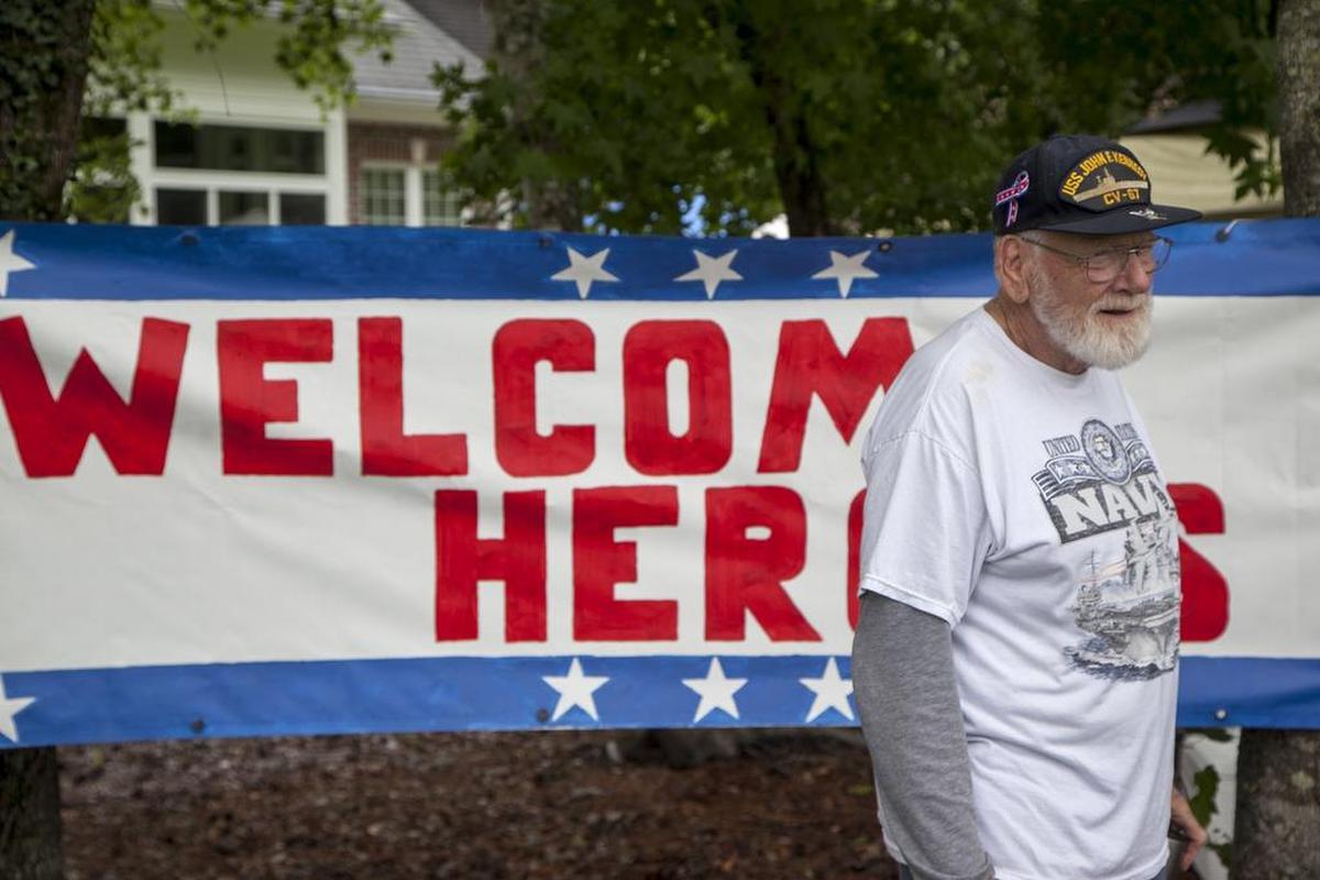 Veterans were met by a grateful group of community residents at the 16th green of the Long Bay Club during the 2017 Veterans Golf Classic. Community members provided hats, golf towels, hotdogs, baked goods and beverages as they thanked 120 golfers for their military service on Wednesday, June 7, 2017.