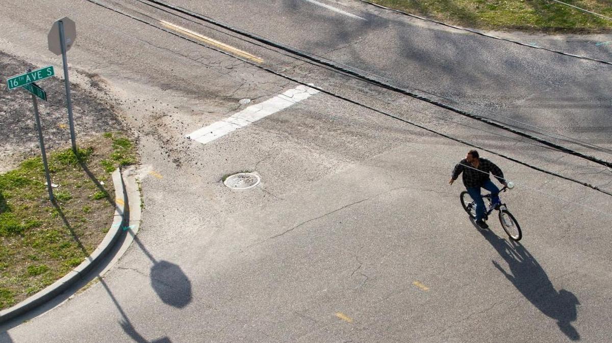A bicyclist crosses Yaupon Drive on Monday, March 6, 2017.